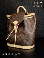 Louis Vuitton monogram canvas mini backpack angled view with cream trim and front tie cords