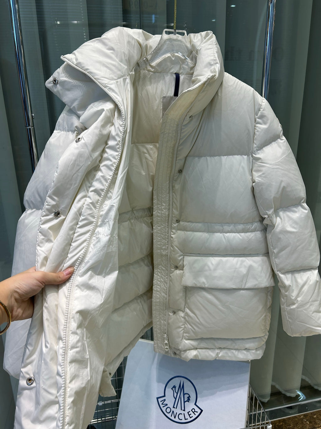 Light cream Moncler hooded puffer jacket with zip front and quilted panels