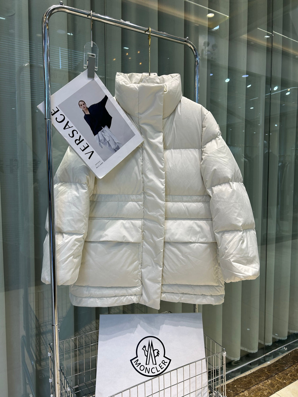White Moncler puffer jacket with hood, front zipper, boxy quilted design