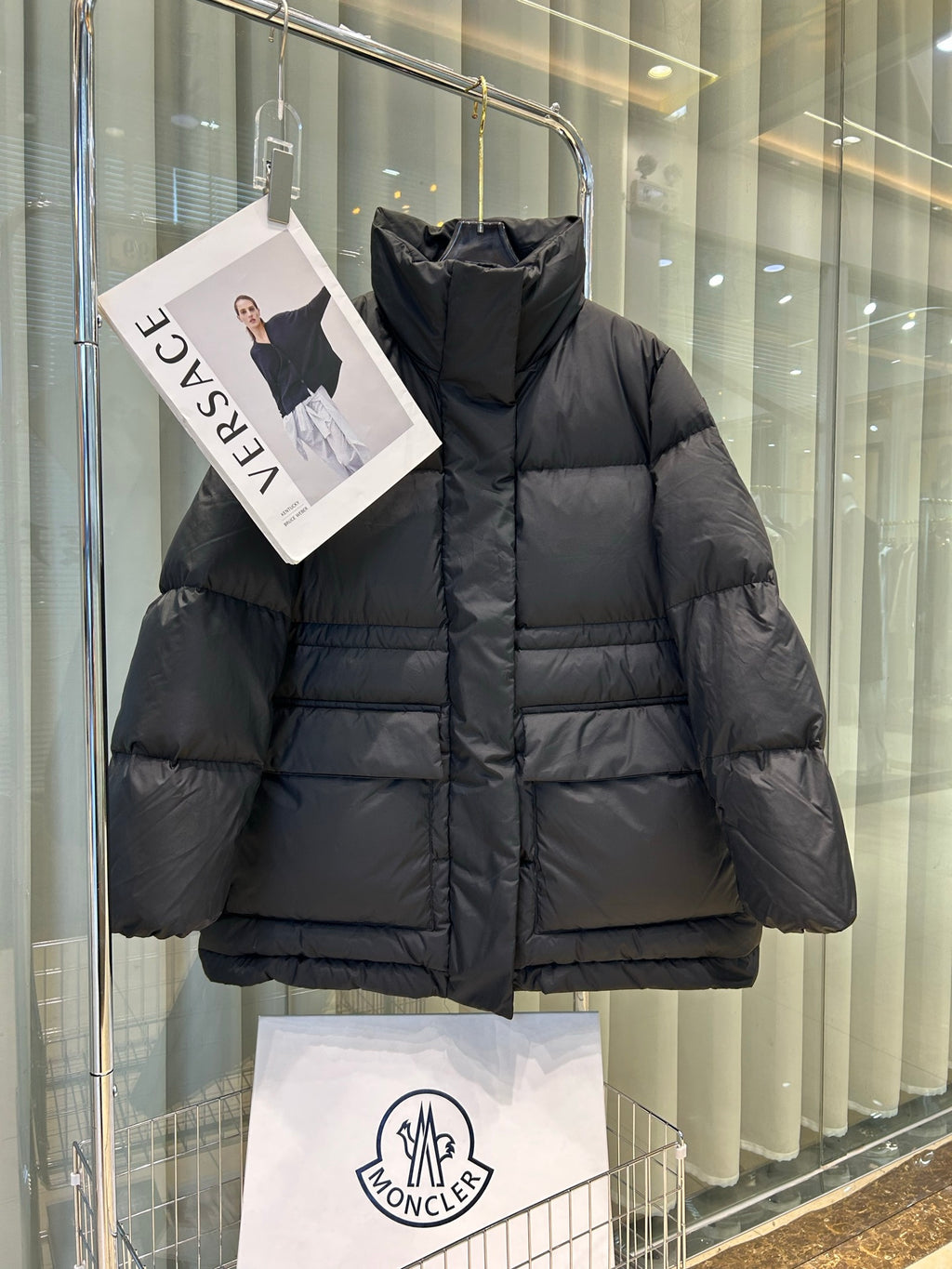 Black Moncler hooded puffer jacket, front zipper, quilted horizontal baffles