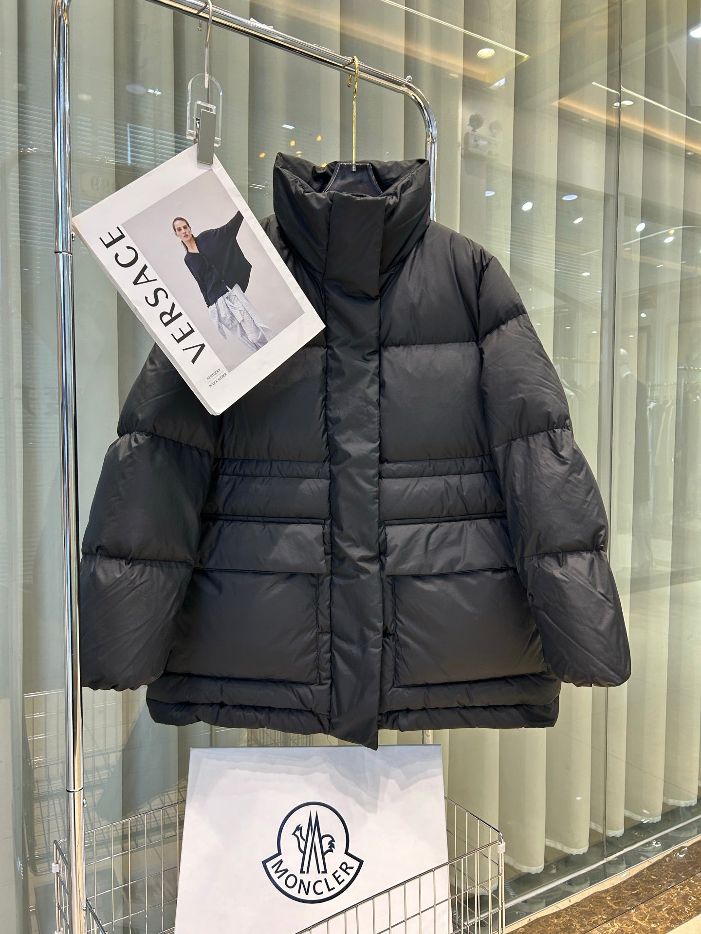 Black Moncler hooded puffer jacket, front zipper, quilted horizontal baffles