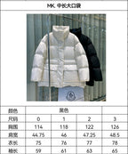 Long Moncler puffer jacket with hood, white quilted padding, front zipper.