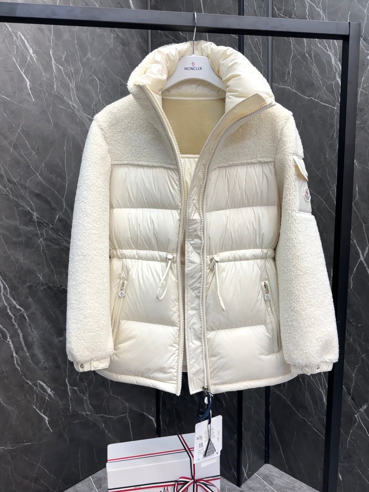 Cream hooded long down jacket with front zip and drawstring-style pockets