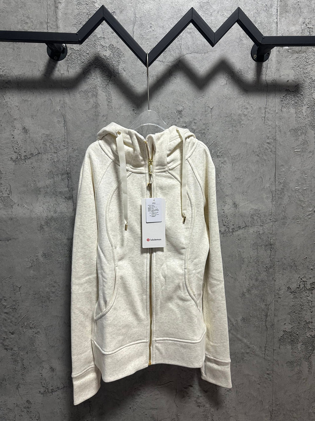 Cream zip-up hoodie with hood and front gold-tone zipper