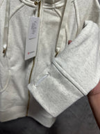 Cream zip-up hoodie sleeve with kangaroo pocket