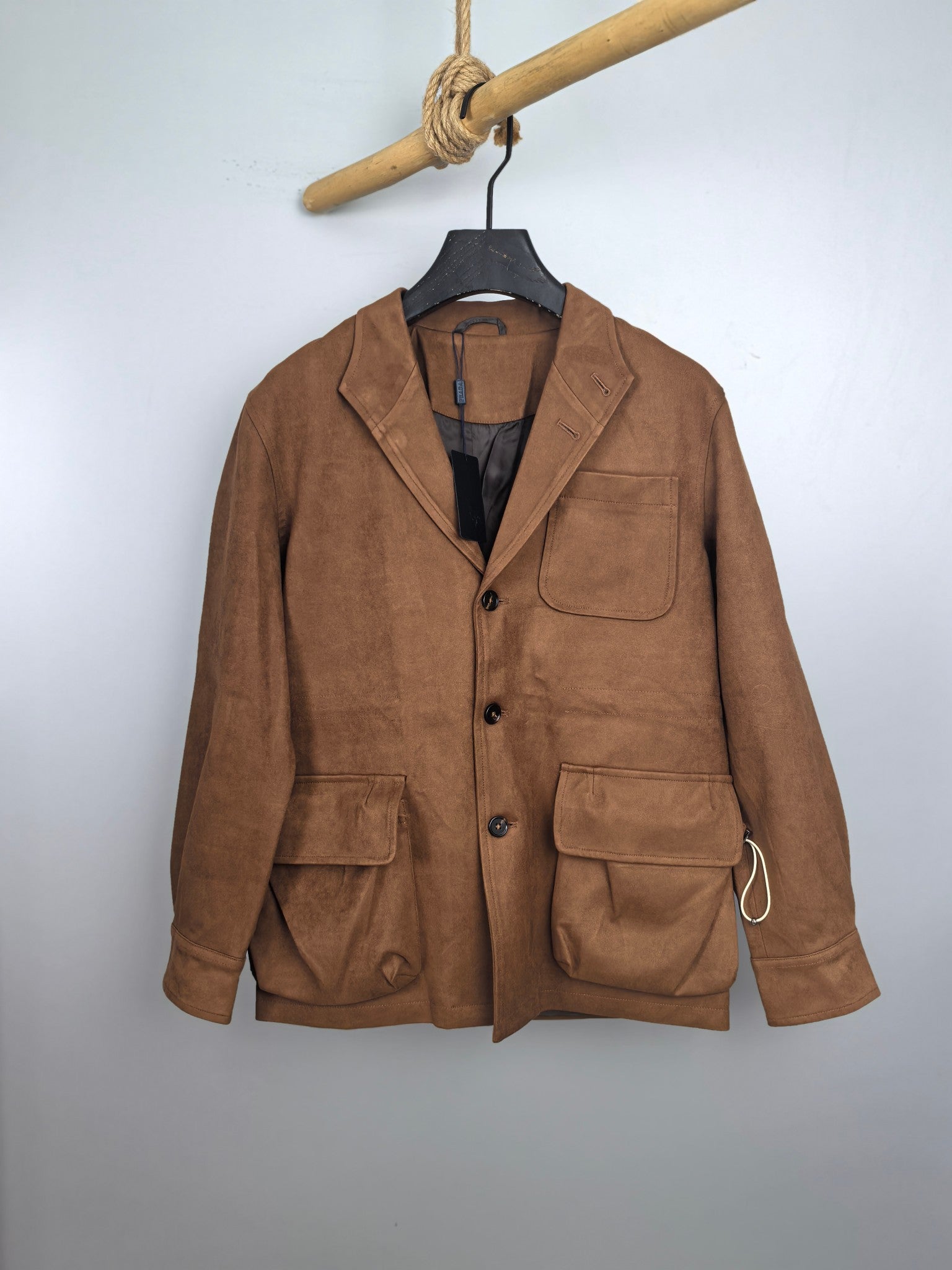 Brown suede-style jacket with front buttons and chest flap pockets