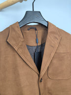 Brown suede-style jacket lapels with black inner lining and button placket