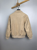 Tan zip-up jacket back view with stand collar and ribbed hem