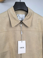 Tan jacket with point collar, front zipper, and Dior logo tag