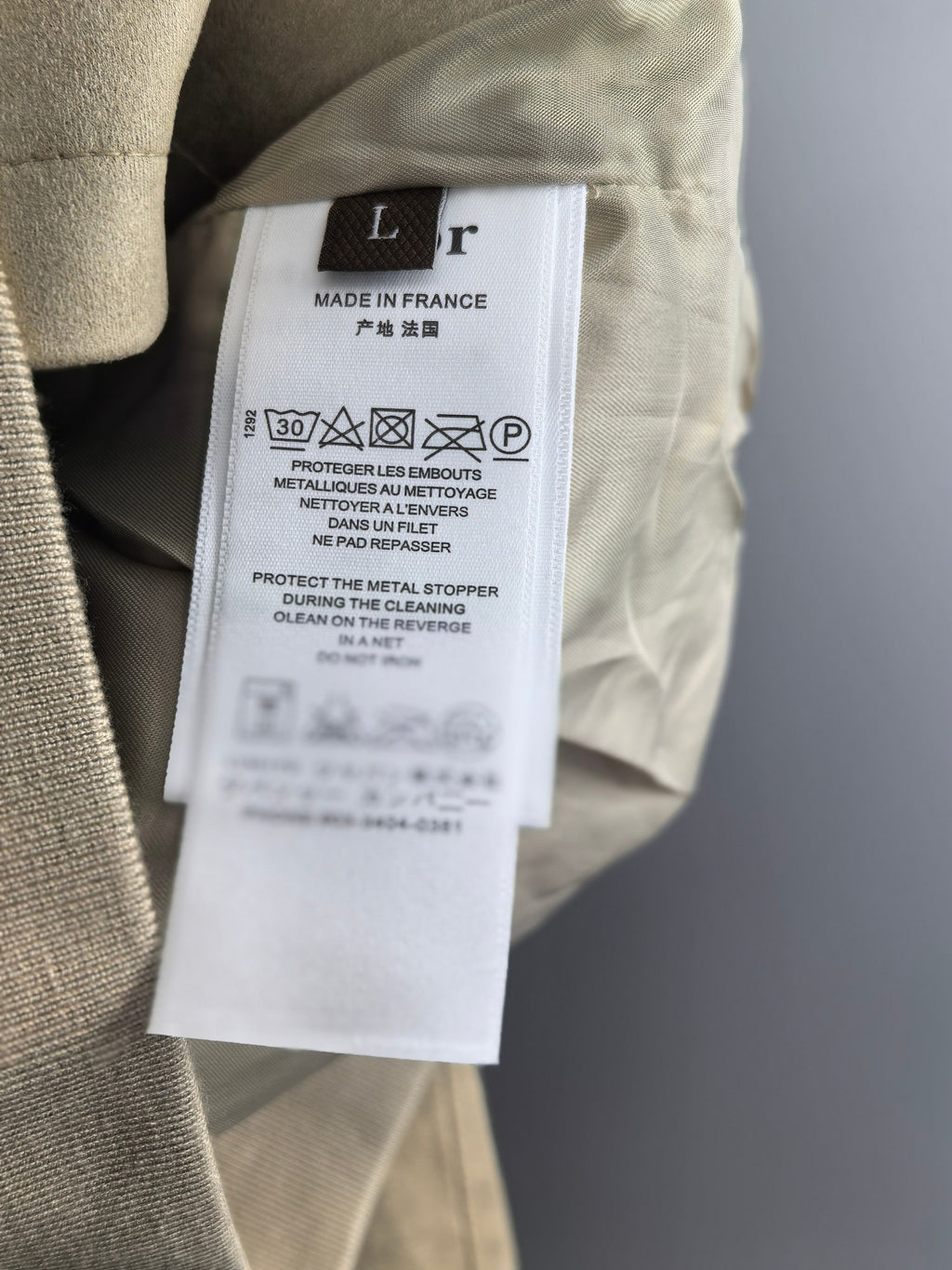 Jacket care label with Made in France and wash instructions