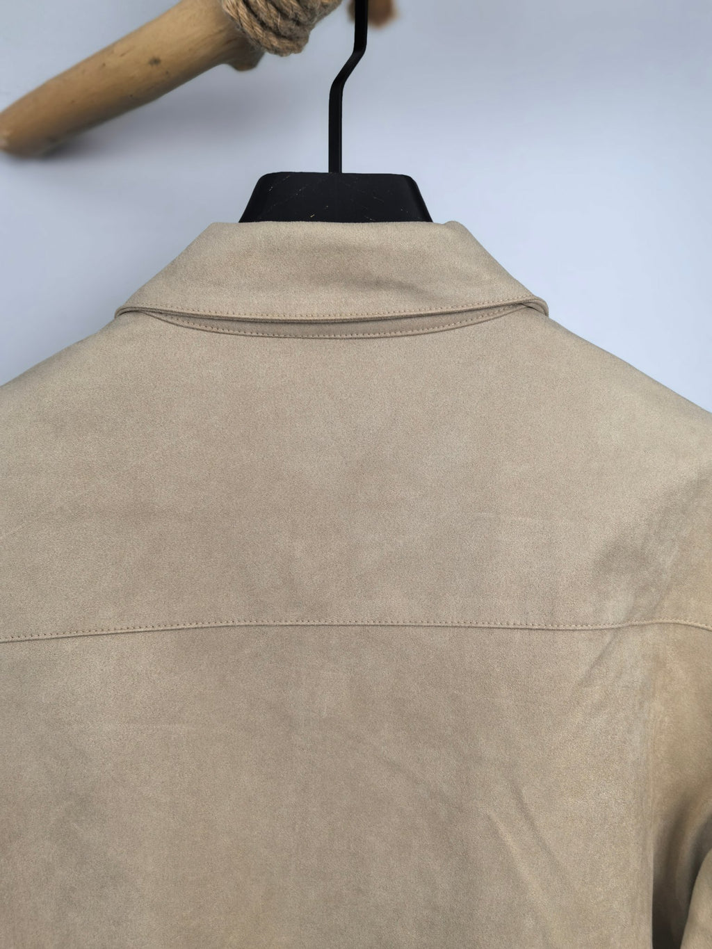 Tan jacket back with stand collar and center seam line