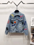 Light-wash denim jacket with multicolor graphic patches, button-front, flap chest pockets