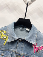 Light-wash denim jacket with pointed collar and patch embroidery on front shoulders