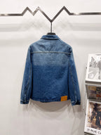 Light blue denim jacket back view with monogram pattern and button cuffs