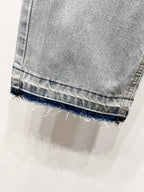 Light blue denim jeans with frayed cuff hem and stitched hem detail