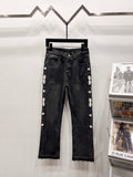 Black denim cropped jeans with front button and side studded floral embellishments