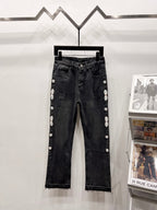 Black denim cropped jeans with front button and side studded floral embellishments