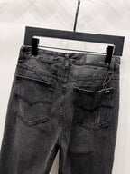 Black denim jeans with back yoke and two buttoned welt pockets