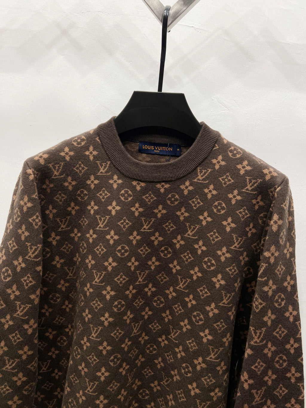 Crewneck sweater collar with dark monogram knit pattern, brown