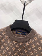 Crewneck sweater neck with visible Louis Vuitton logo tag and monogram knit