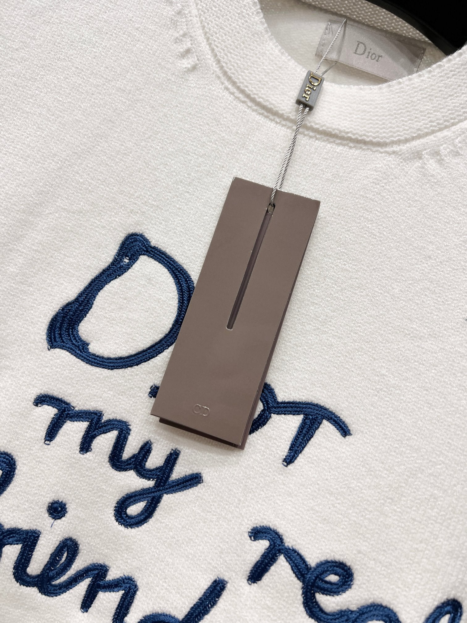 White crewneck sweatshirt with neck label and blue script 'for my real friends'