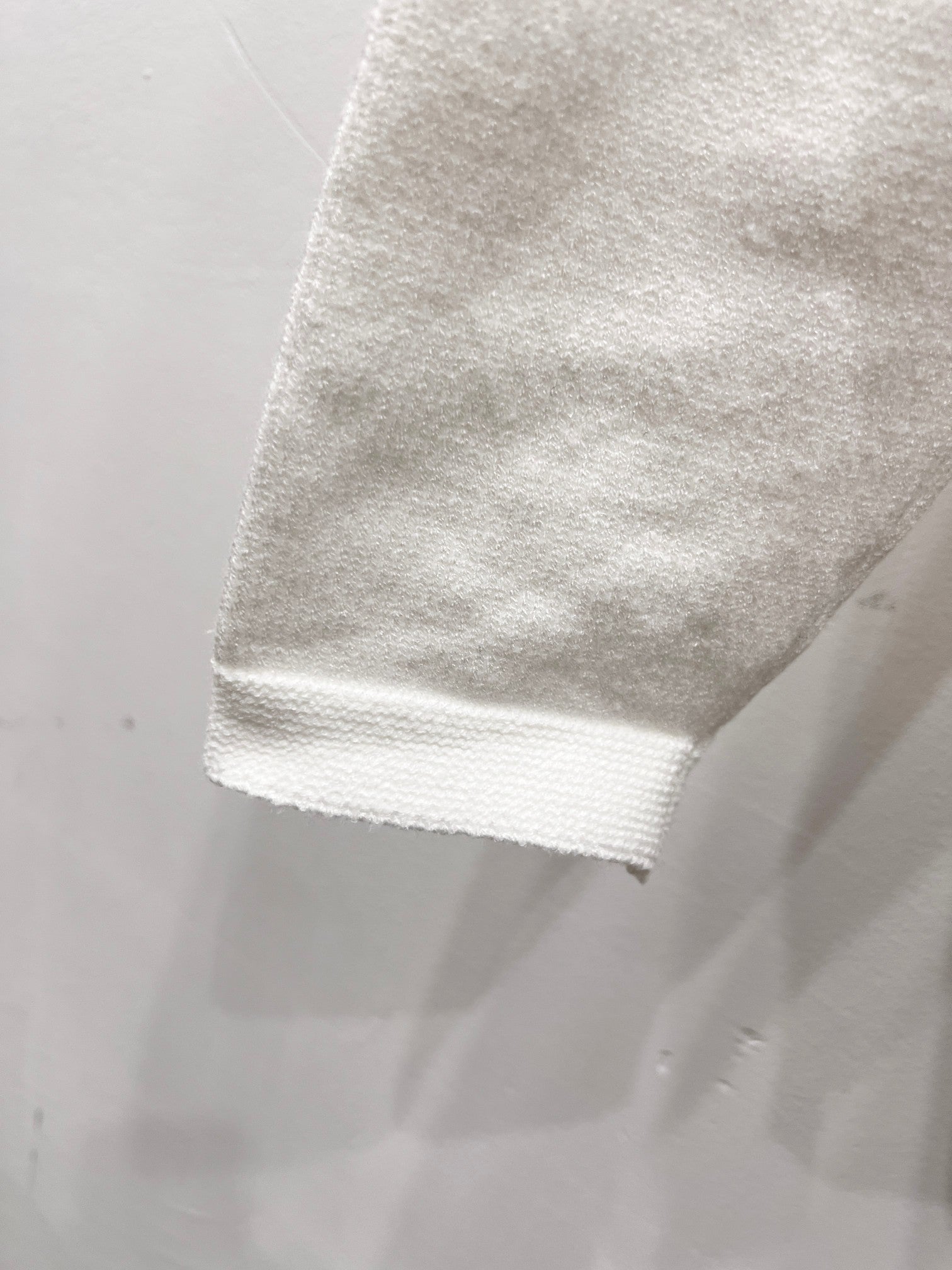 White sweatshirt cuff and hem detail