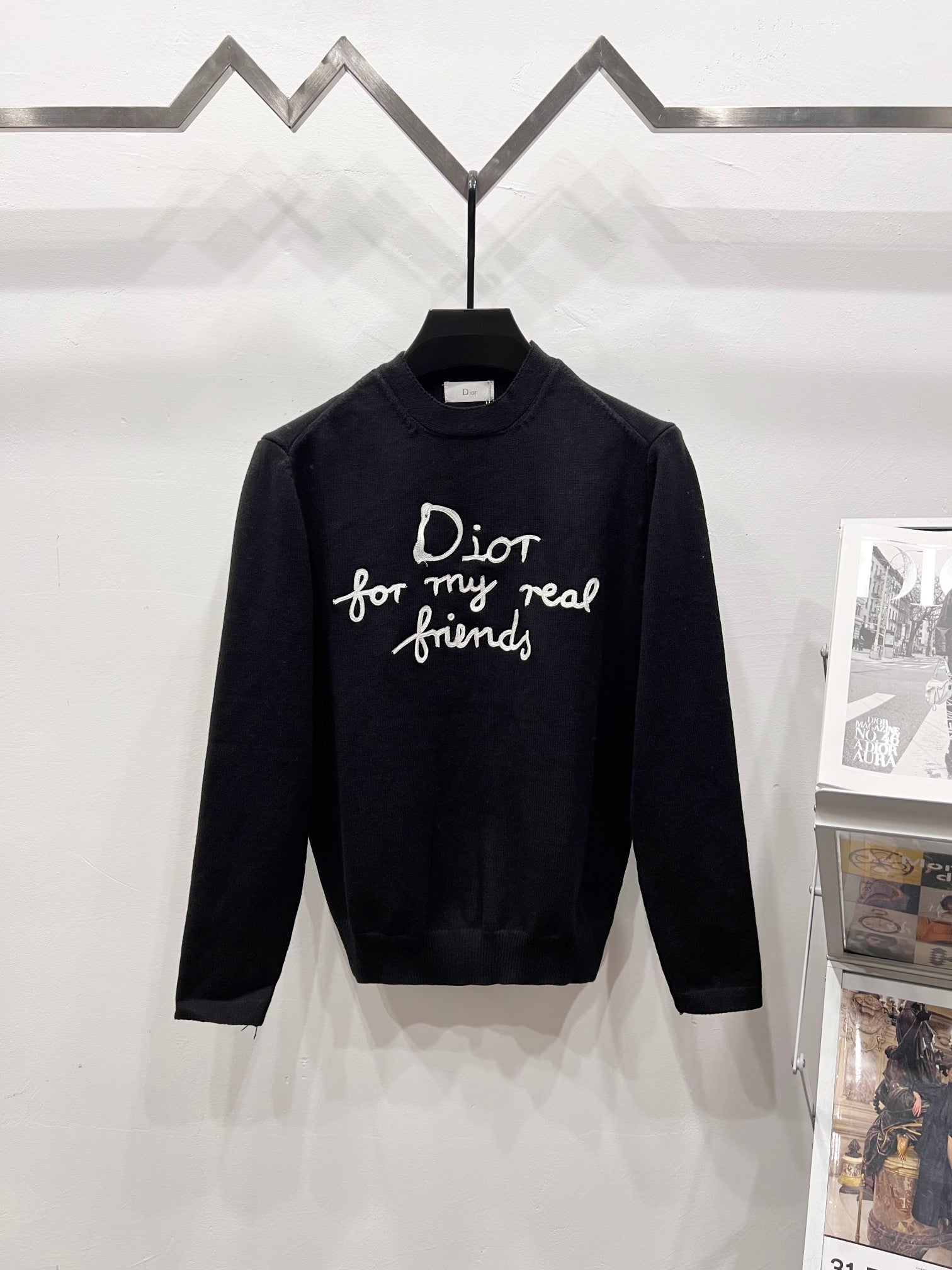 Black crewneck sweater with long sleeves and Dior friends graphic