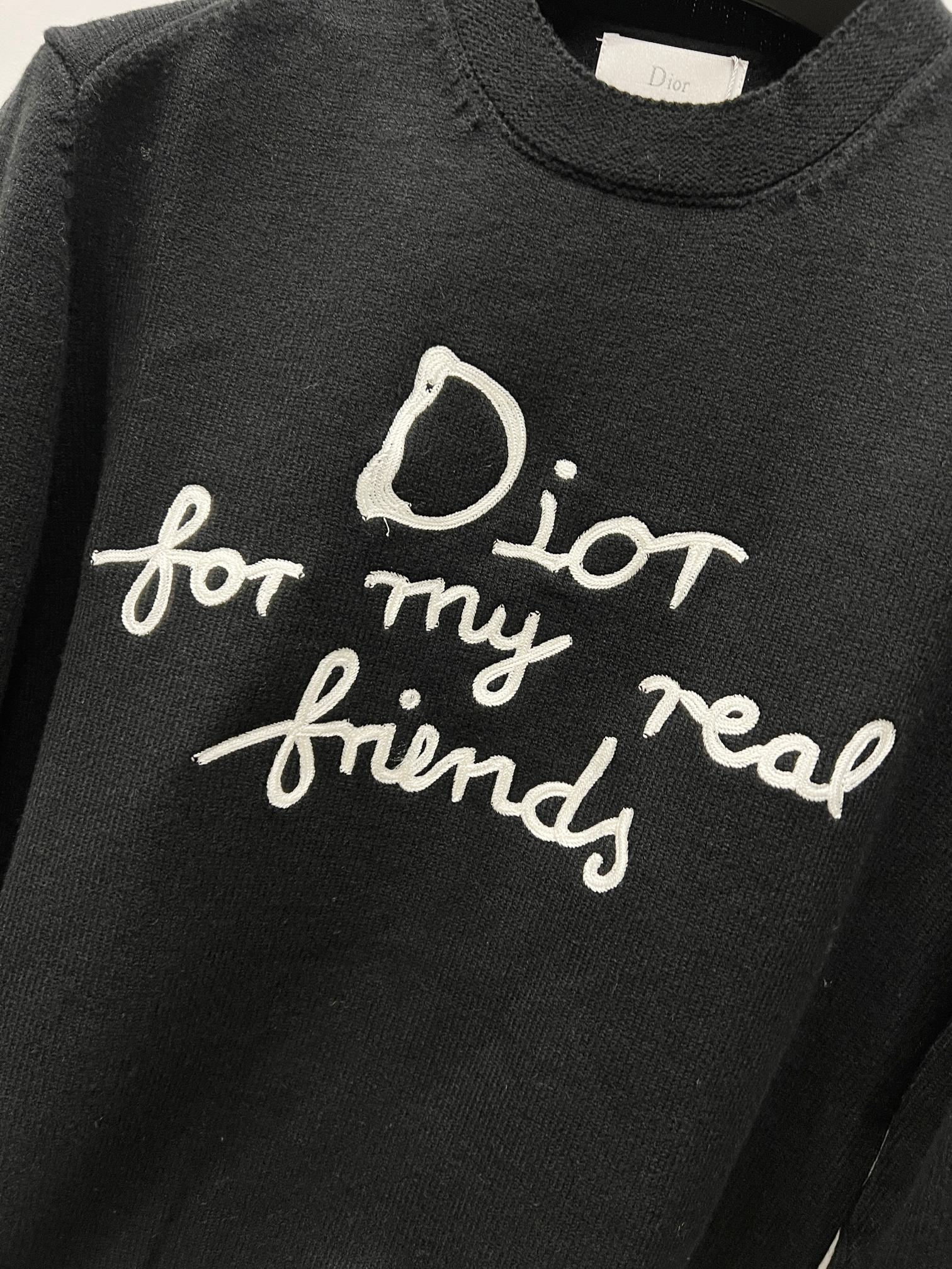 Black knit sweater with large “for my real friends” script print