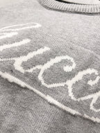 Gray knit fabric with white Gucci lettering detail