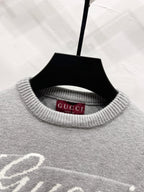 Gray sweater neckline with ribbed knit and Gucci label inside