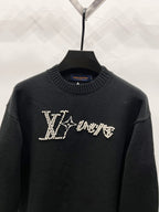 Louis Vuitton black sweater with rhinestone LV logo across the chest