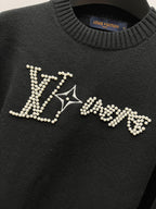 Louis Vuitton black sweater front with large rhinestone LV logo
