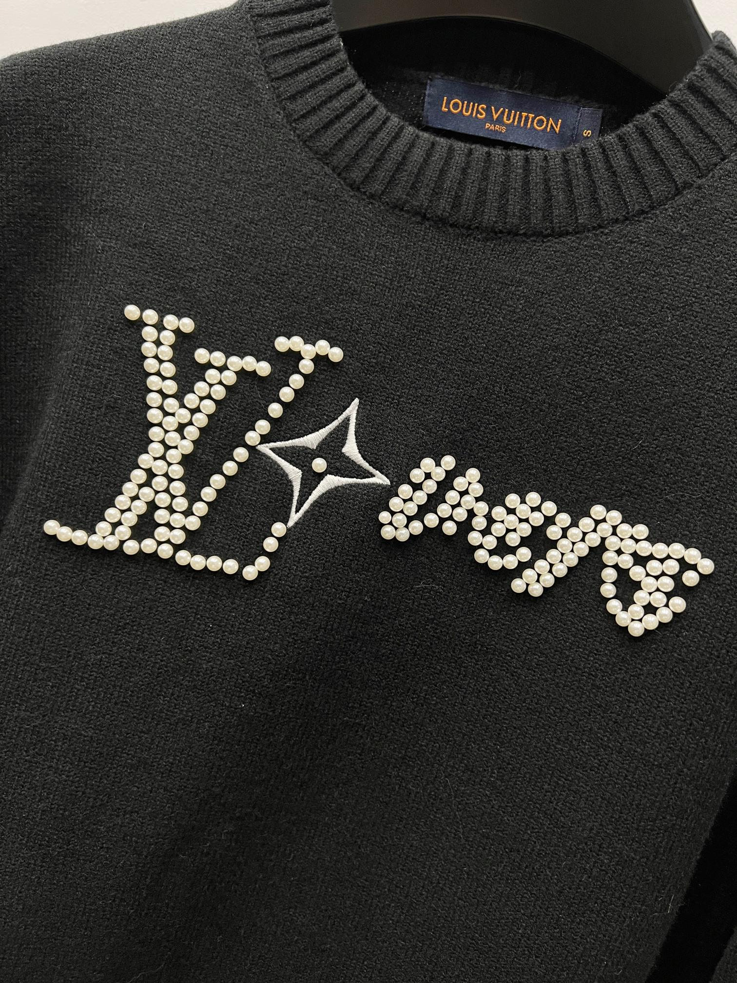 Louis Vuitton black sweater front with large rhinestone LV logo