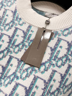 Inner neck tag area on logo knit sweater, off-white knit with blue pattern