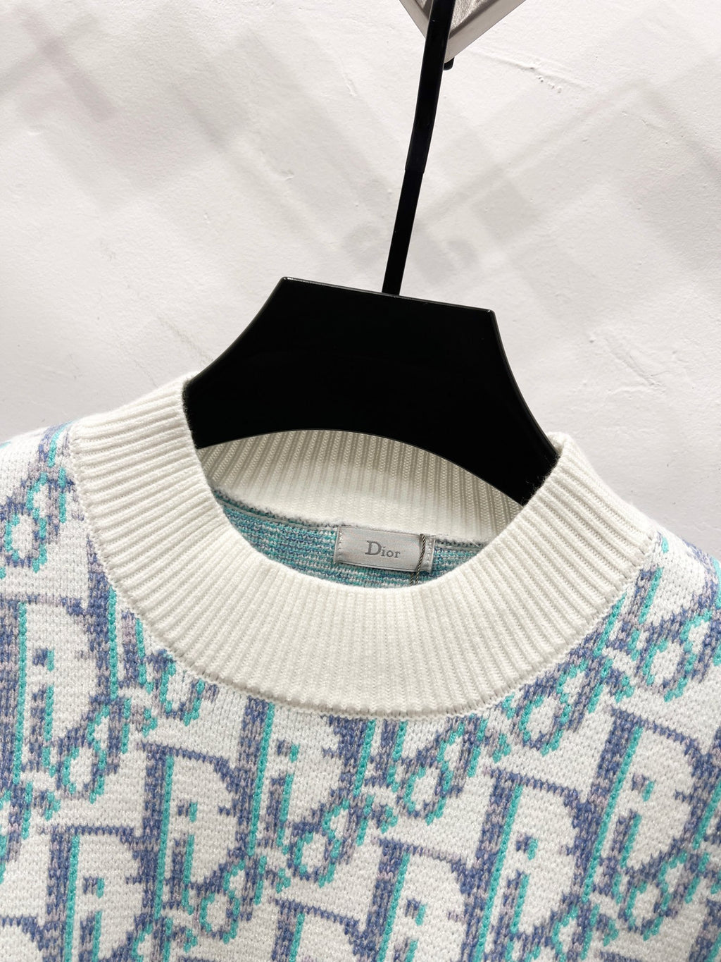 Ribbed crew neck sweater with light blue logo pattern and off-white knit trim