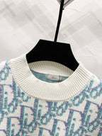 Ribbed crew neck sweater with light blue logo pattern and off-white knit trim