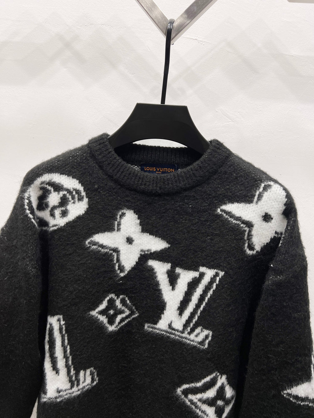Louis Vuitton long-sleeve sweater, dark knit with white star and LV-style graphic