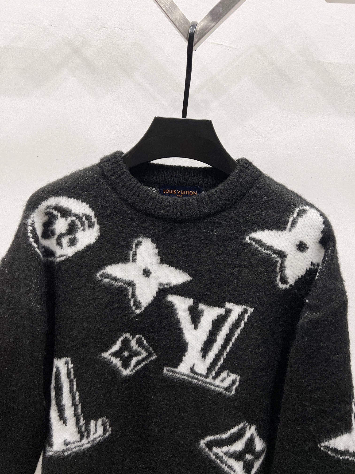 Louis Vuitton long-sleeve sweater, dark knit with white star and LV-style graphic