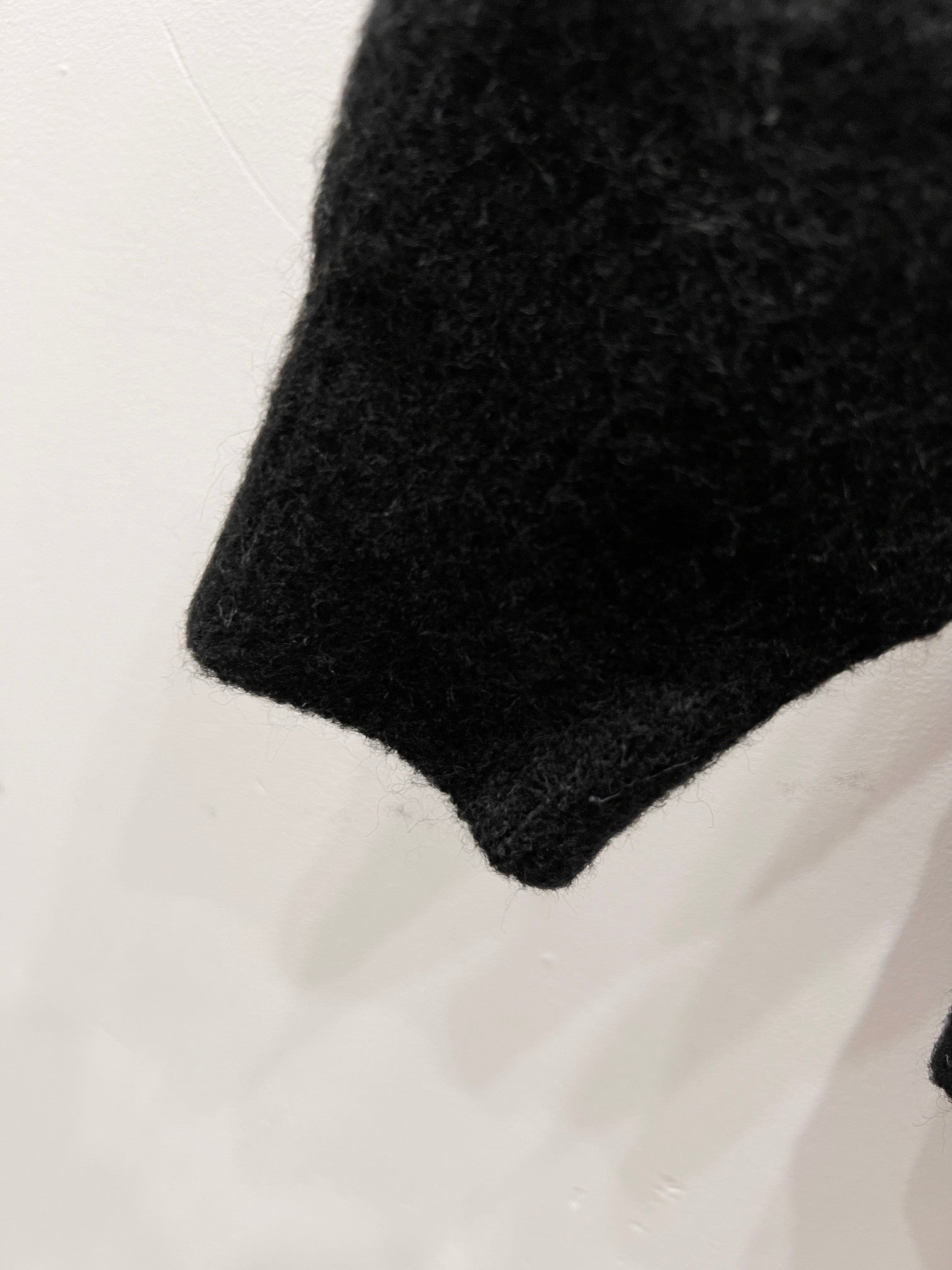 Black knit sweater hem with ribbed trim