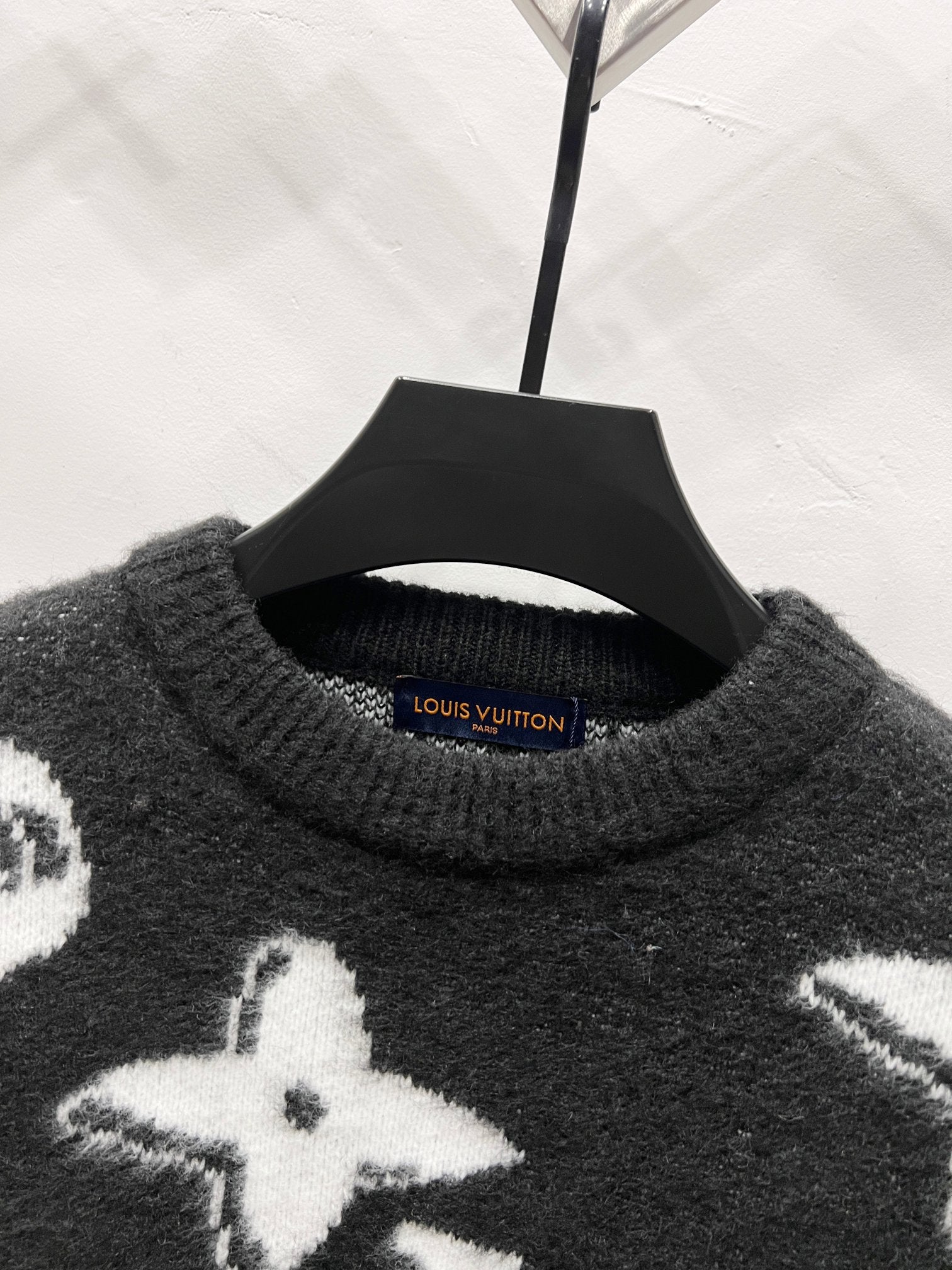 Louis Vuitton crewneck sweater, dark knit with white star motifs on front