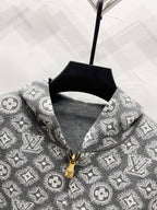Patterned zip hoodie neckline detail in dark gray with gold zipper pull