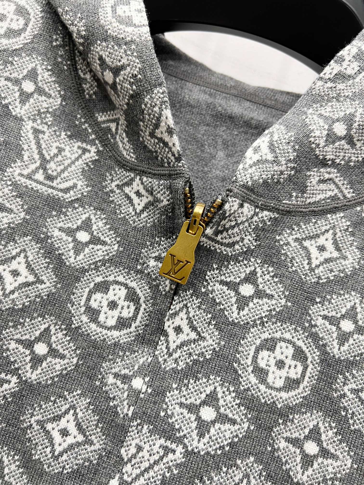 Patterned knit fabric on zip hoodie in dark gray with gold zipper pull