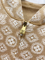 Tan monogram zip-up hoodie fabric and zipper pull detail