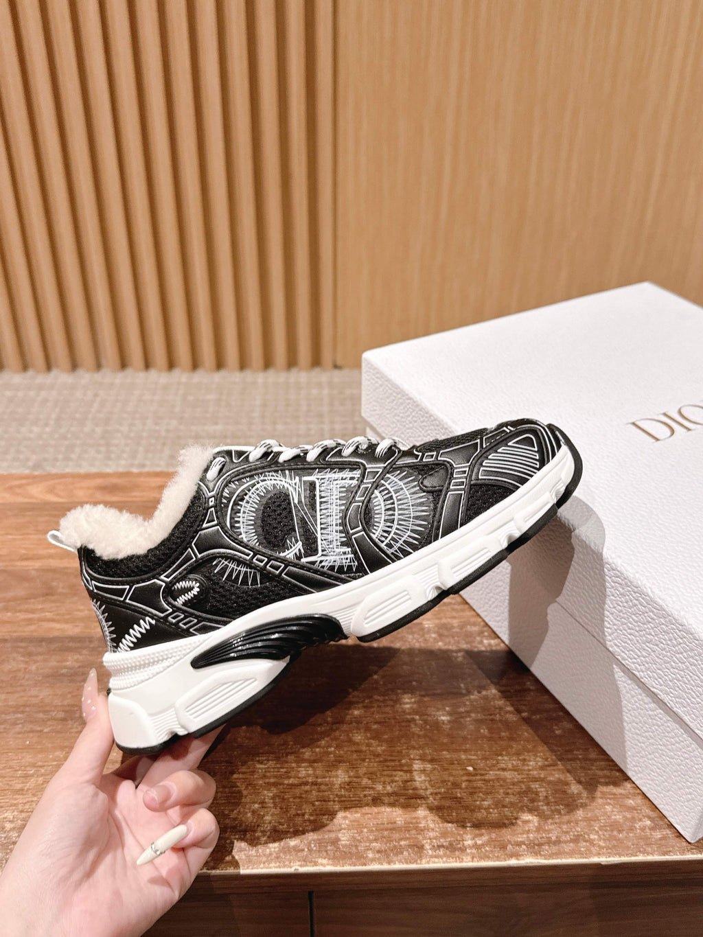 Unisex sneakers, black-and-white patterned upper, white laces, faux fur collar, thick sole
