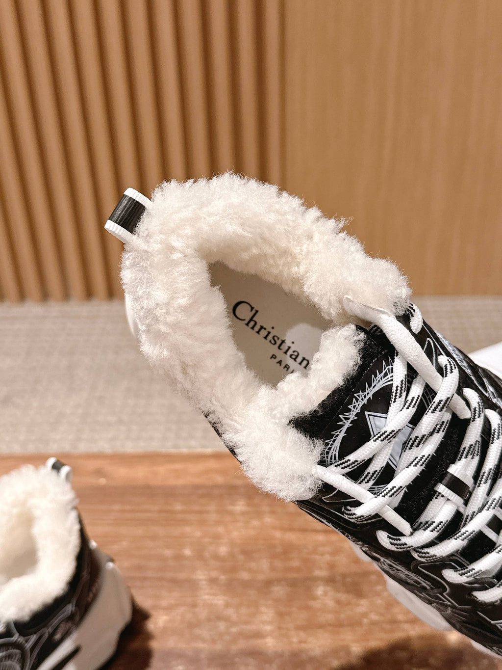 Faux fur-lined sneaker interior with 'Christian Dior' print on insole