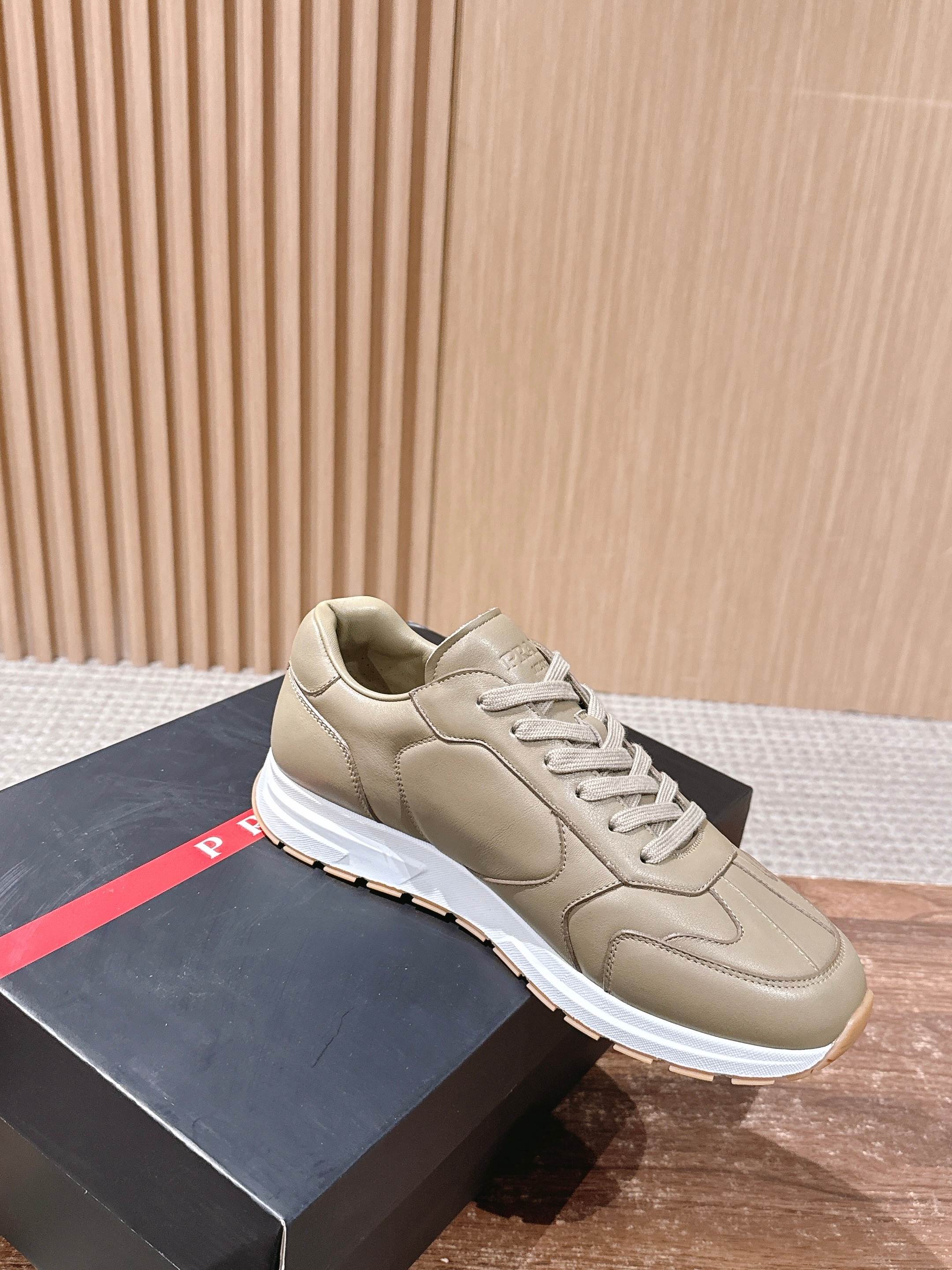 Prada unisex beige sneakers with lace-up front and white rubber sole