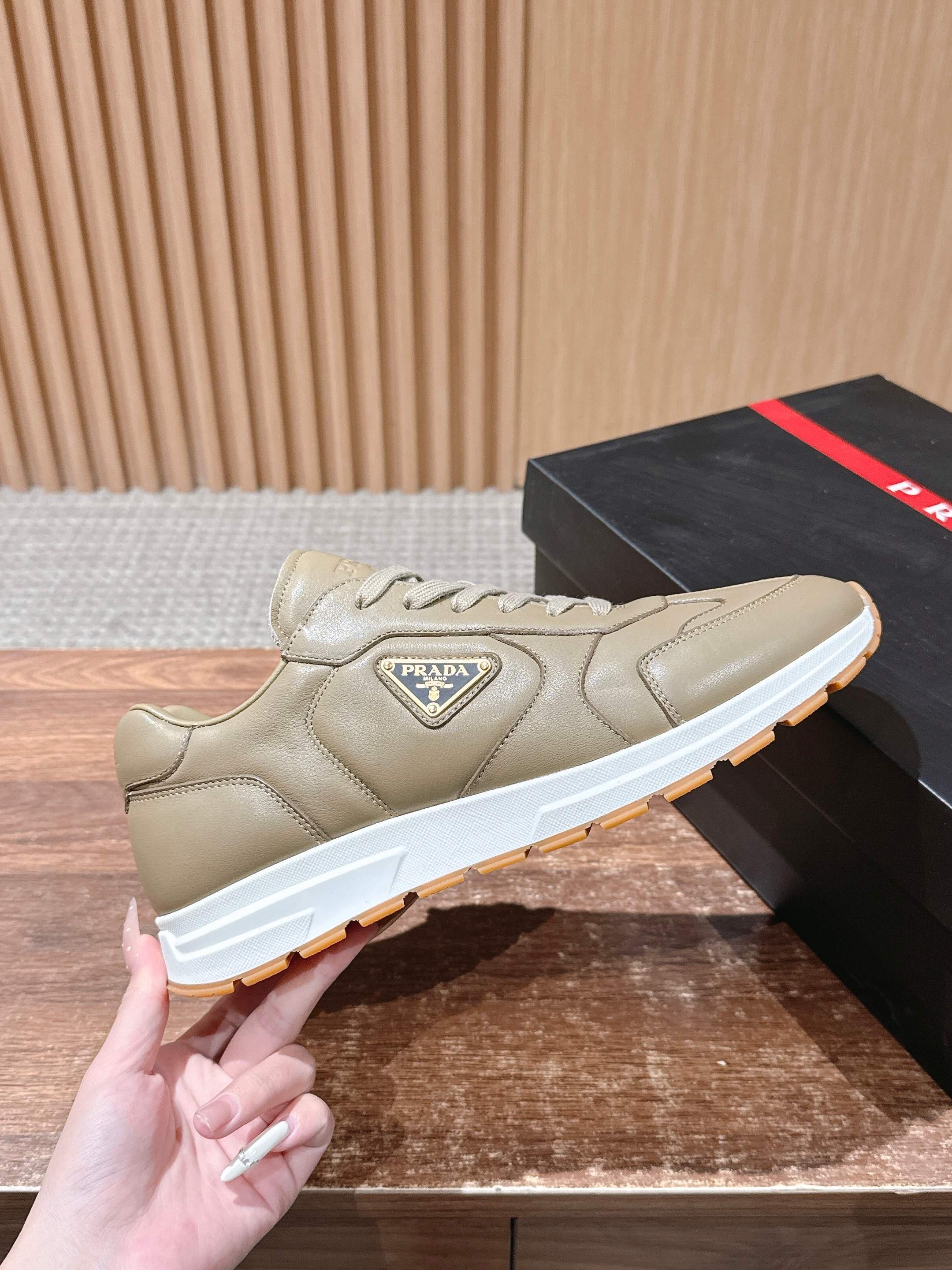 Prada unisex beige sneakers with lace-up ties and Prada logo on side