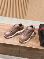 Taupe leather unisex sneakers, lace-up style with white midsoles.