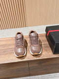Taupe leather unisex sneakers with lace-up front and white rubber sole.