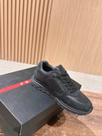 Dark unisex sneakers with lace-up closure and stitched overlay details